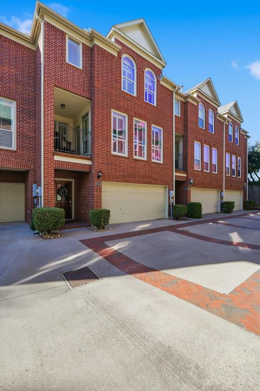 2615 Colby Street, Unit B Dallas, TX 75204 - Photo 3 of 39 View of building exterior with driveway and an attached garage