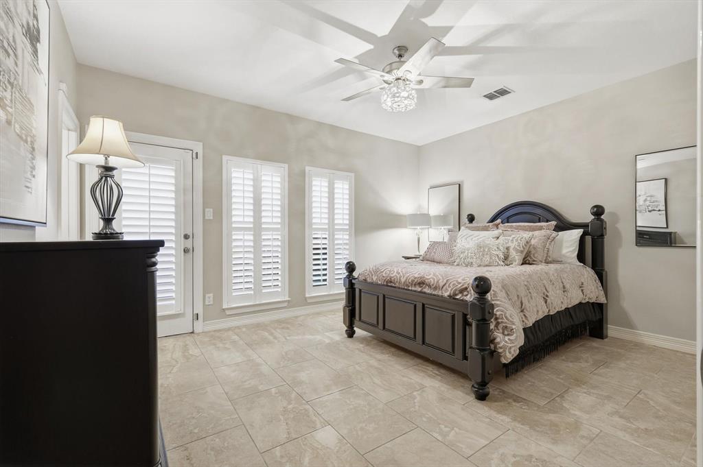2615 Colby Street, Unit B Dallas, TX 75204 - Photo 6 of 39 1st floor Bedroom with large walk-in closet, ensuite bath, access to exterior and ceiling fan