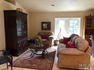 33688 Iversen Road Gualala, CA 95445 - Photo 1 of 1 a living room with furniture and a window