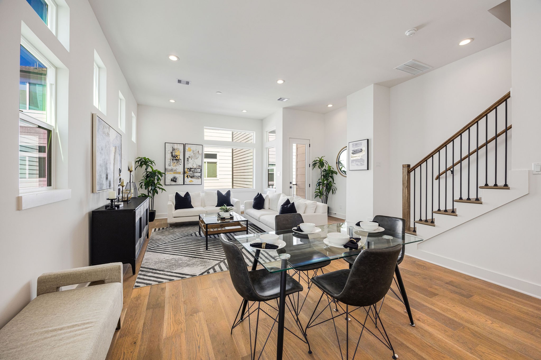 303 Marcella Street, Unit F Houston, TX 77091 - Photo 14 of 29 View of the dining area seamlessly connected to the living room and balcony perfect for entertaining and family gatherings.