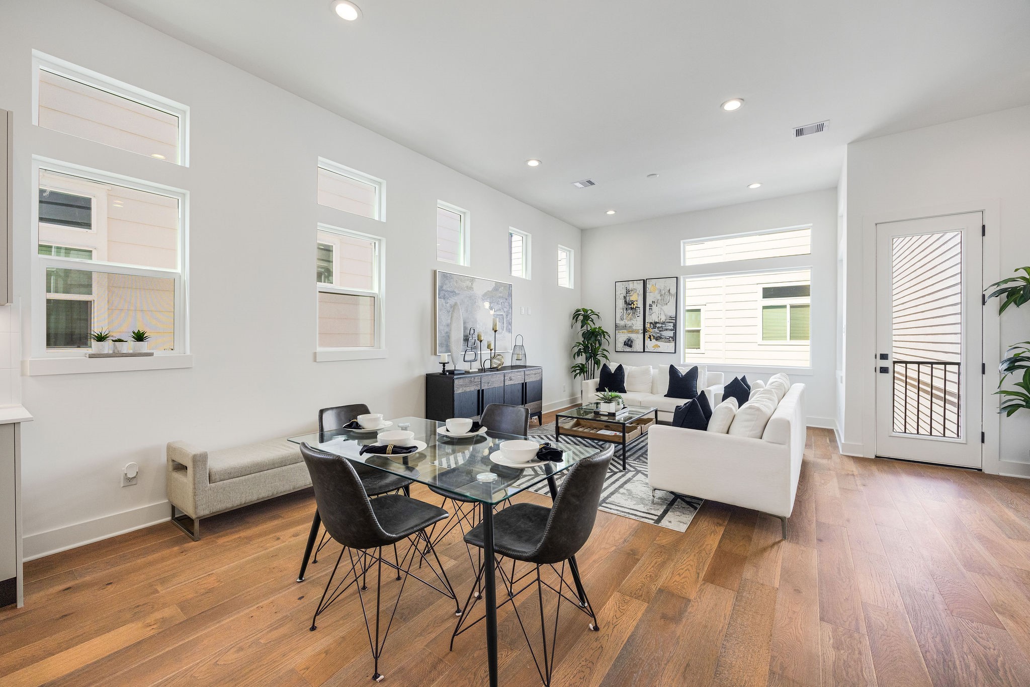303 Marcella Street, Unit F Houston, TX 77091 - Photo 15 of 29 Another view of the dining area seamlessly connected to the living room and balcony perfect for entertaining and family gatherings.