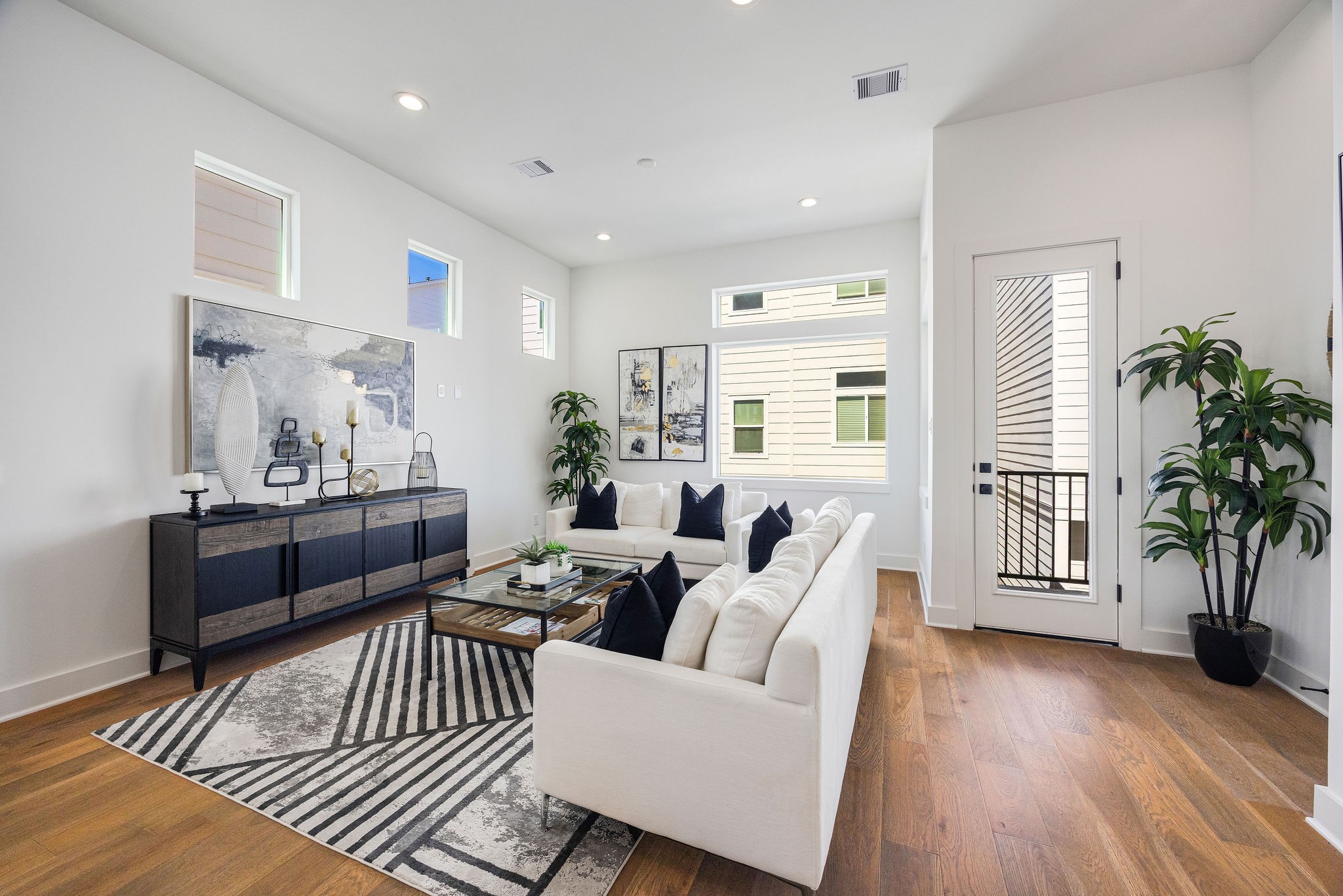 303 Marcella Street, Unit F Houston, TX 77091 - Photo 17 of 29 Another view of the living area and balcony perfect for entertaining and family gatherings.