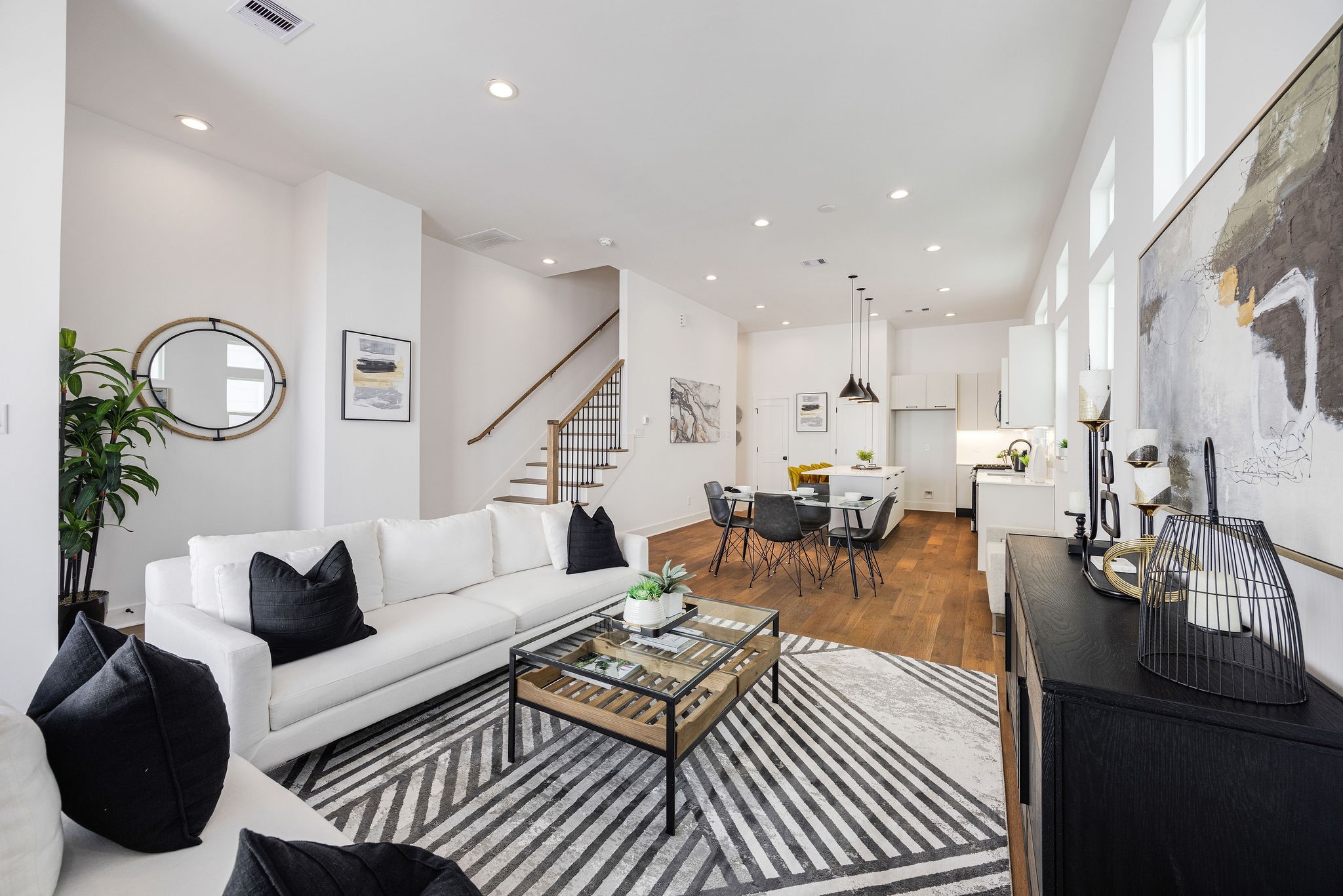 303 Marcella Street, Unit F Houston, TX 77091 - Photo 20 of 29 Elegant dining area seamlessly connected to a modern kitchen, perfect for entertaining and family gatherings.