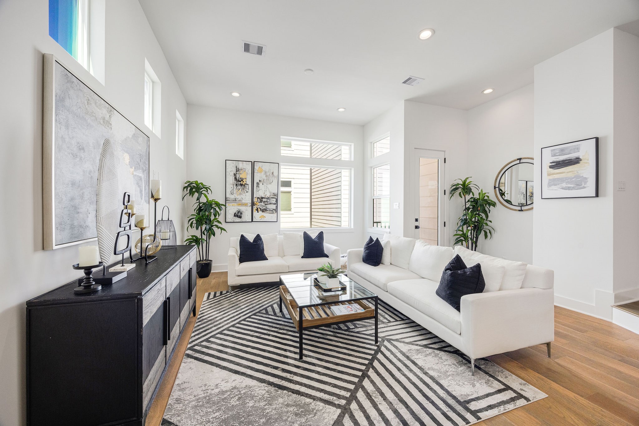 303 Marcella Street, Unit F Houston, TX 77091 - Photo 2 of 29 Elegant open-concept dining and living area with modern finishes and abundant natural light.