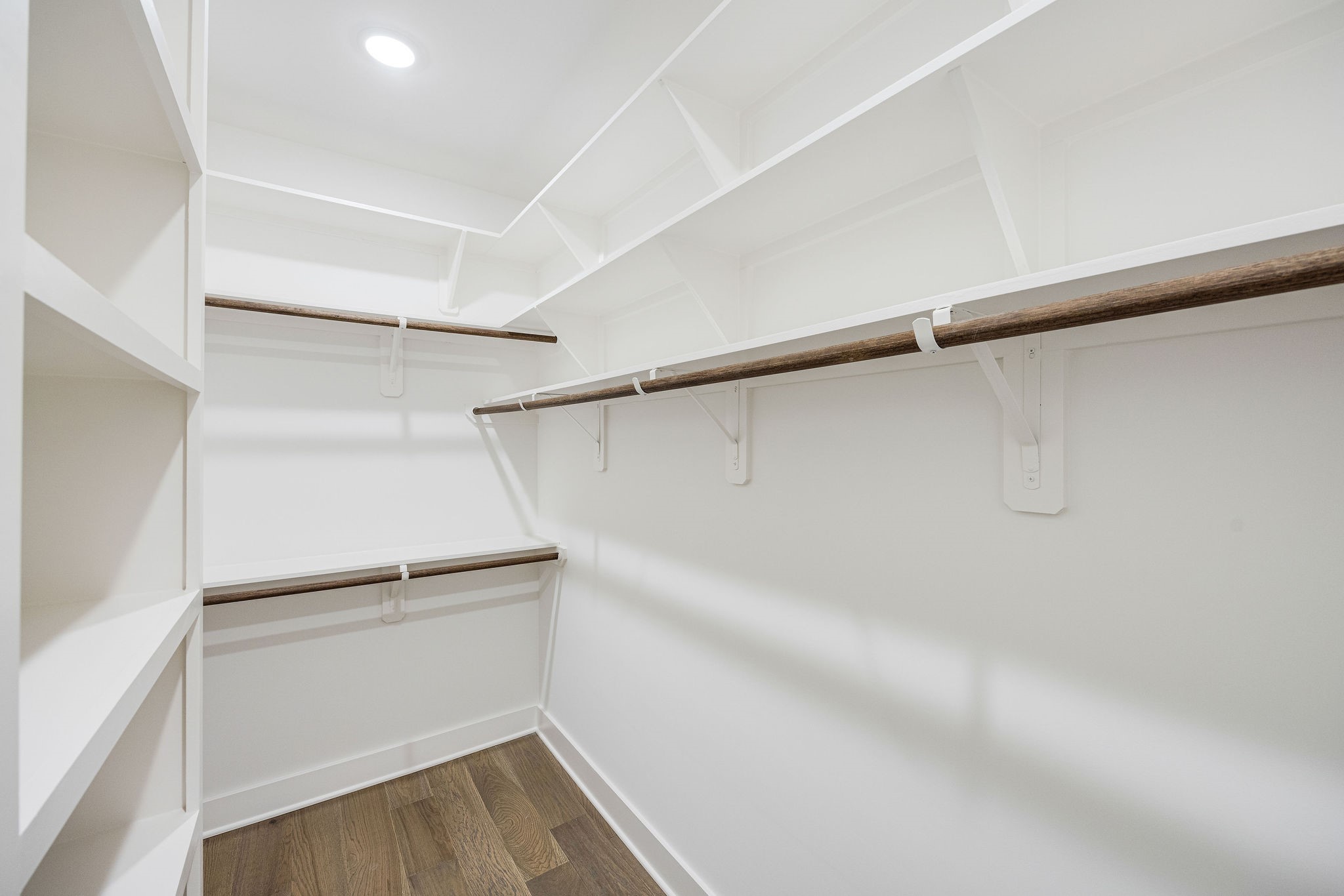 303 Marcella Street, Unit F Houston, TX 77091 - Photo 24 of 29 Large walk-in primary bedroom closet with built-in shelving