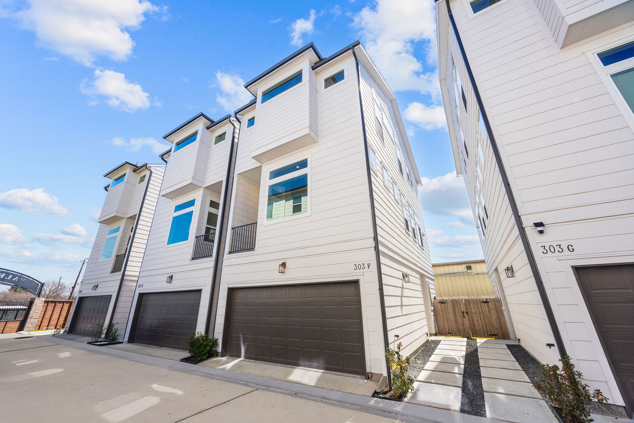 303 Marcella Street, Unit F Houston, TX 77091 - Photo 27 of 29 Exterior of the home, with a spacious 2-car garage.