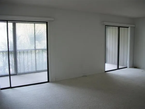 an empty room with sliding door