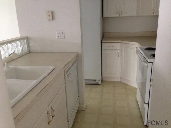 a view of storage and utility room with empty racks