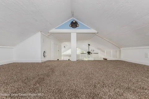 a view of house with a iron fence