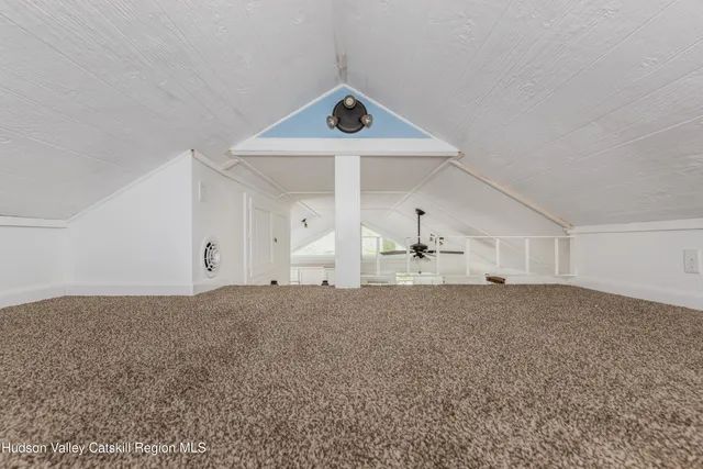 a view of house with a iron fence