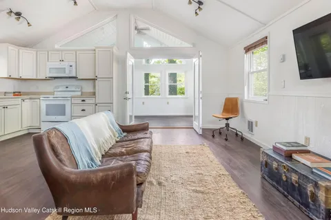 a bathroom with a granite countertop toilet sink and mirror