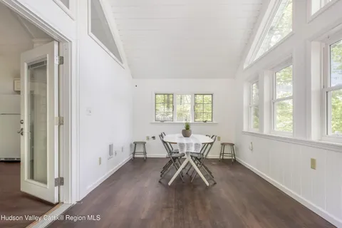 a view of a livingroom with furniture and windows