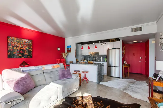 a living room with furniture and a flat screen tv