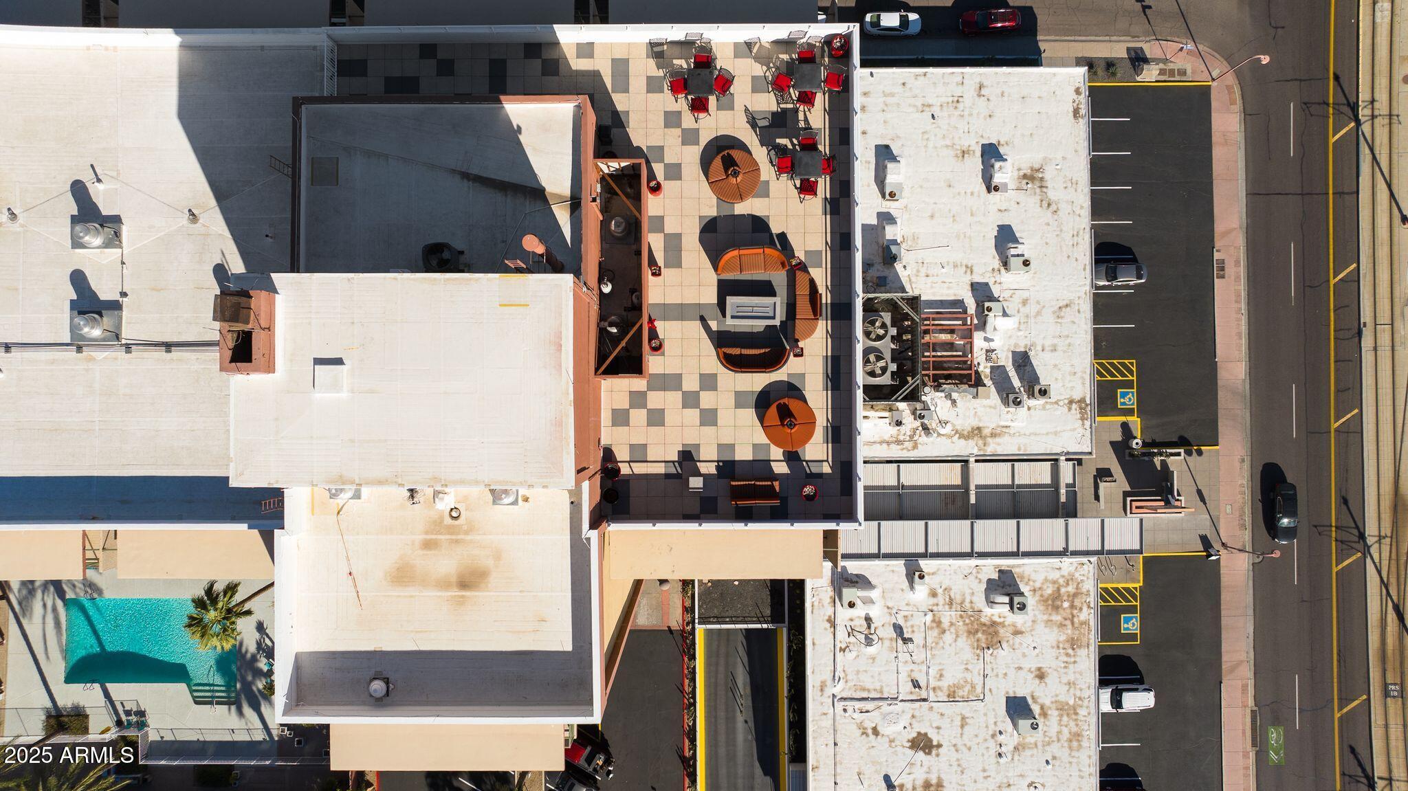 4750 North Central Avenue, Unit 3J Phoenix, AZ 85012 - Photo 9 of 11 an aerial view of residential houses with outdoor space and street view