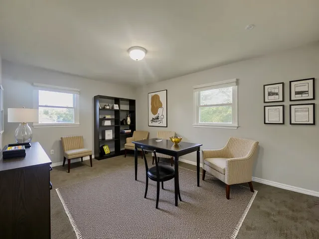 a living room with furniture and a window