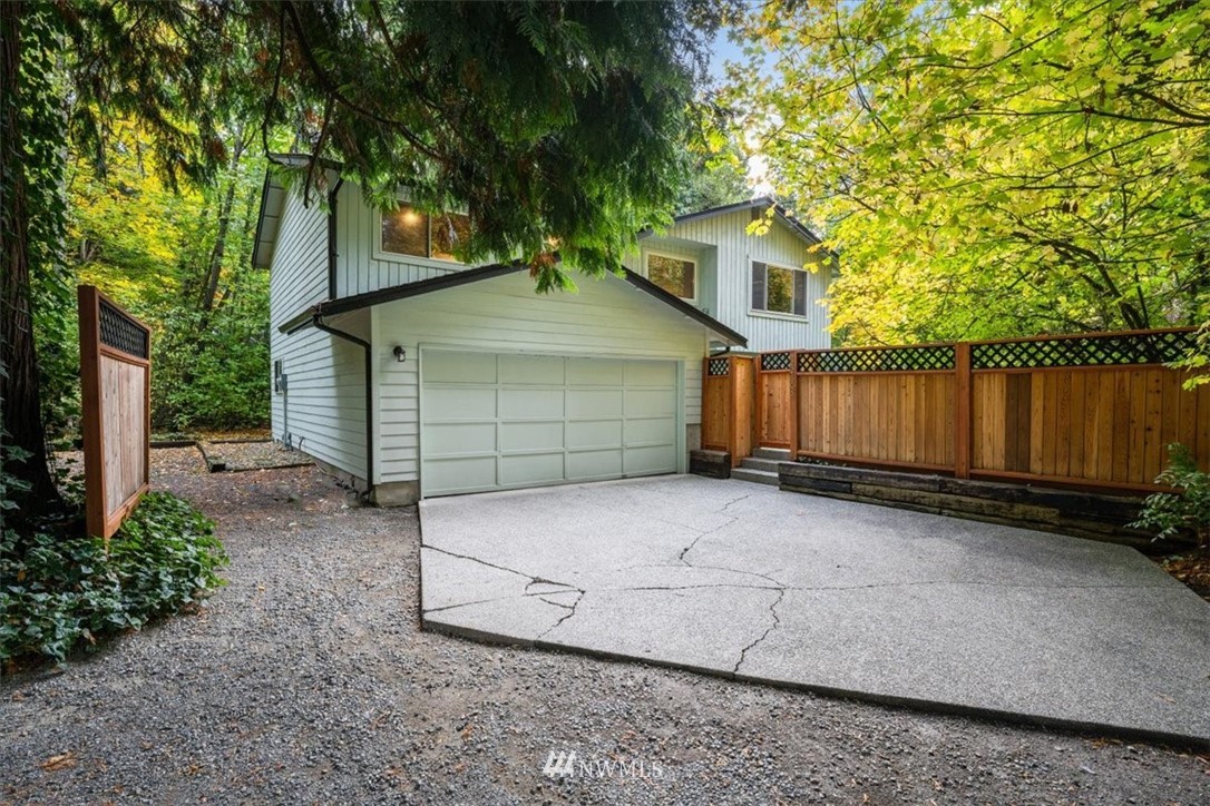22608 31st Avenue Southeast Bothell, WA 98021 - Photo 1 of 36 a view of a house with a yard and garage