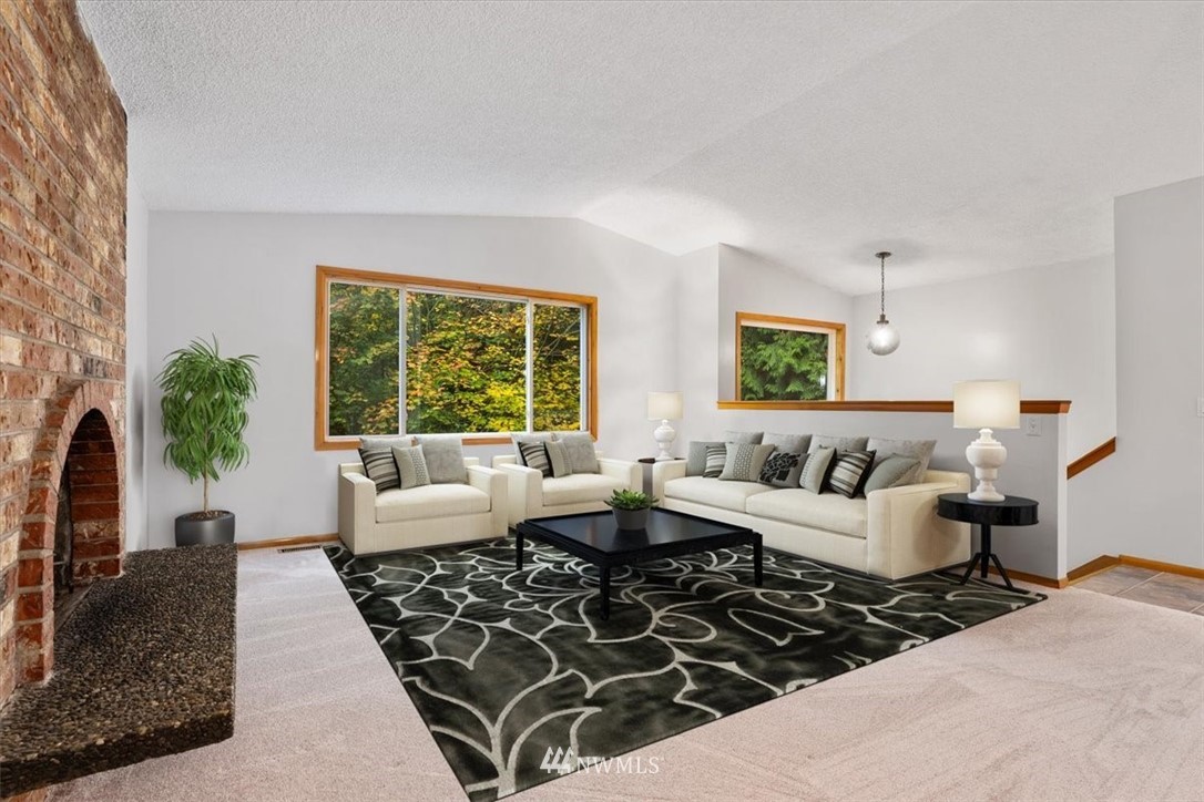22608 31st Avenue Southeast Bothell, WA 98021 - Photo 2 of 36 a living room with furniture and a large window
