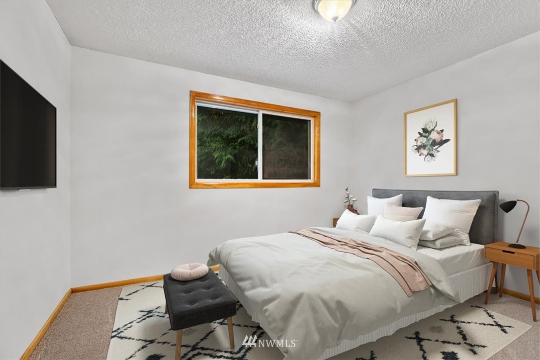 22608 31st Avenue Southeast Bothell, WA 98021 - Photo 11 of 36 a bedroom with a bed and tv