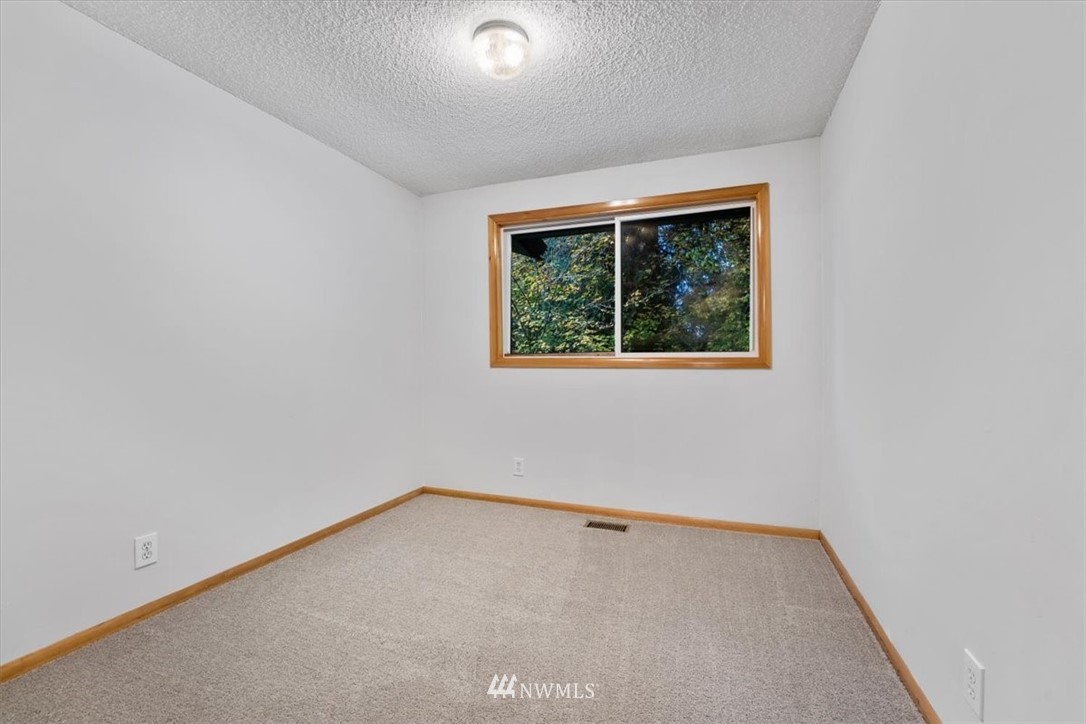 22608 31st Avenue Southeast Bothell, WA 98021 - Photo 12 of 36 an empty room with a window