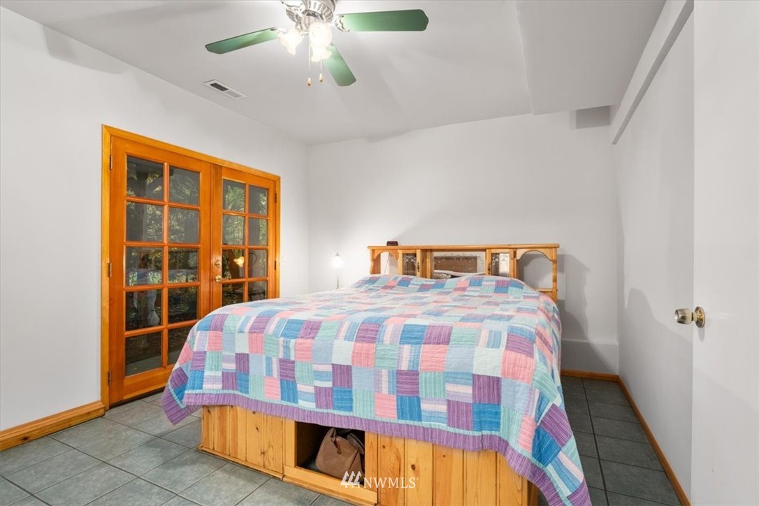22608 31st Avenue Southeast Bothell, WA 98021 - Photo 18 of 36 a bedroom with a bed and a large window