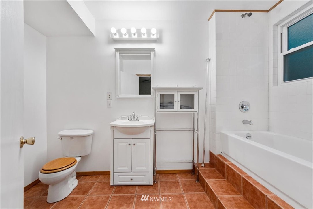 22608 31st Avenue Southeast Bothell, WA 98021 - Photo 20 of 36 a spacious bathroom with a toilet sink and mirror
