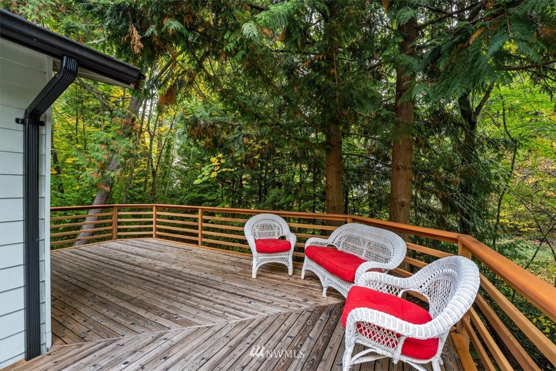 22608 31st Avenue Southeast Bothell, WA 98021 - Photo 26 of 36 a view of deck with furniture and trees