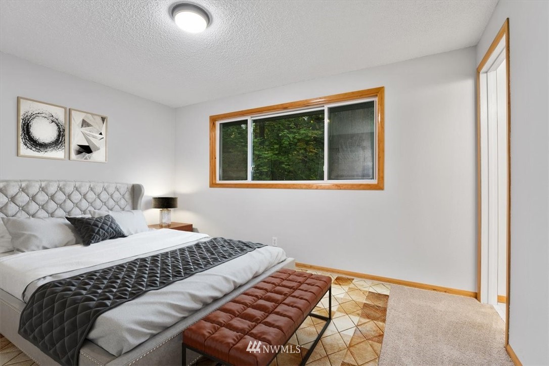 22608 31st Avenue Southeast Bothell, WA 98021 - Photo 9 of 36 a bedroom with a bed and a window