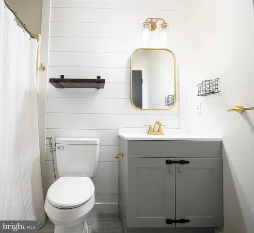 an empty room with closet and wooden floor