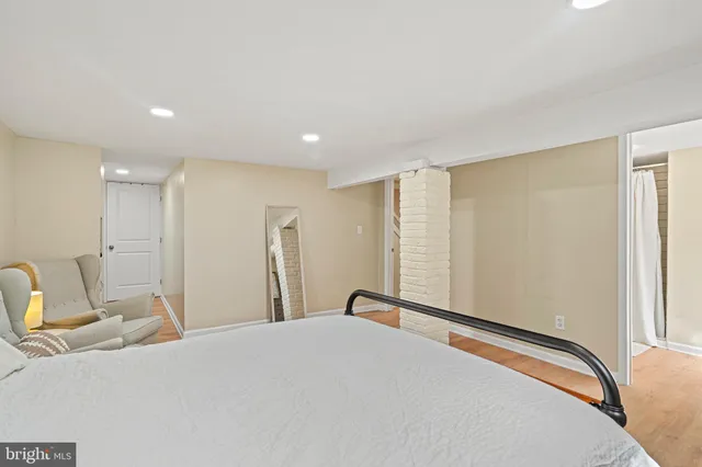 a bed room with a bed and a window