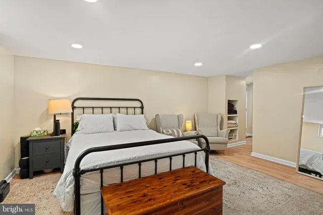 a bedroom with a bed and a tv on table