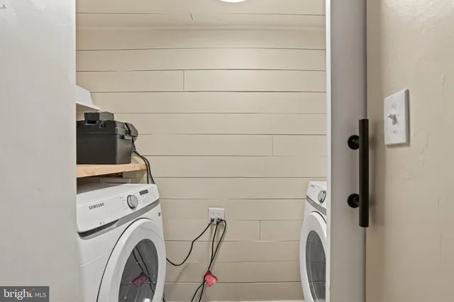 a bathroom with a washer and dryer