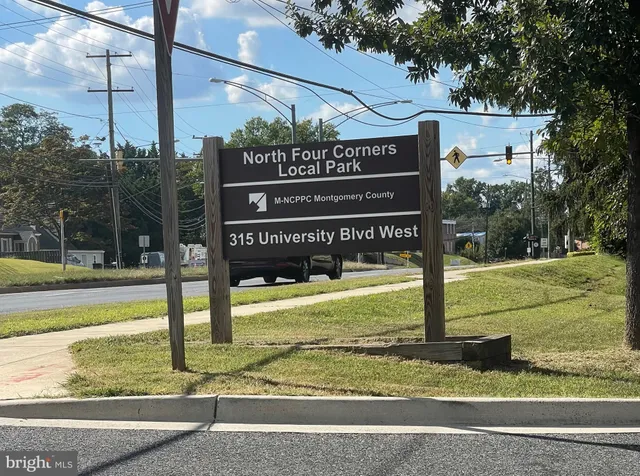 a view of a sign board with a park