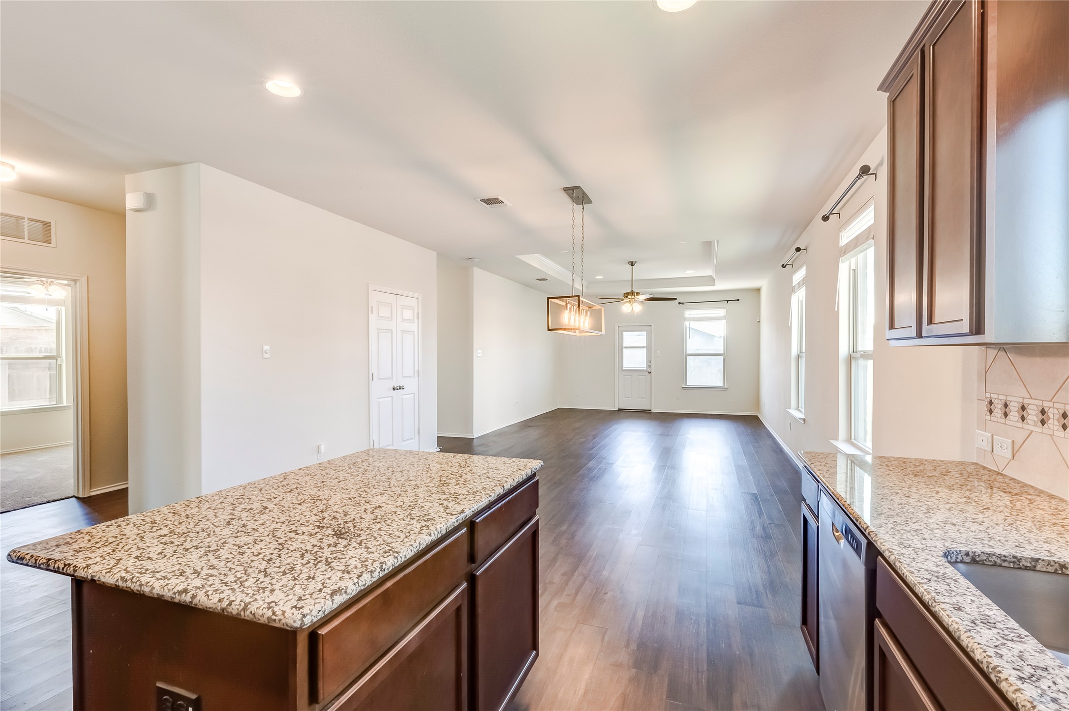 11617 Amber Stream Lane Manor, TX 78653 - Photo 39 of 39 a kitchen with a counter top space and wooden floor