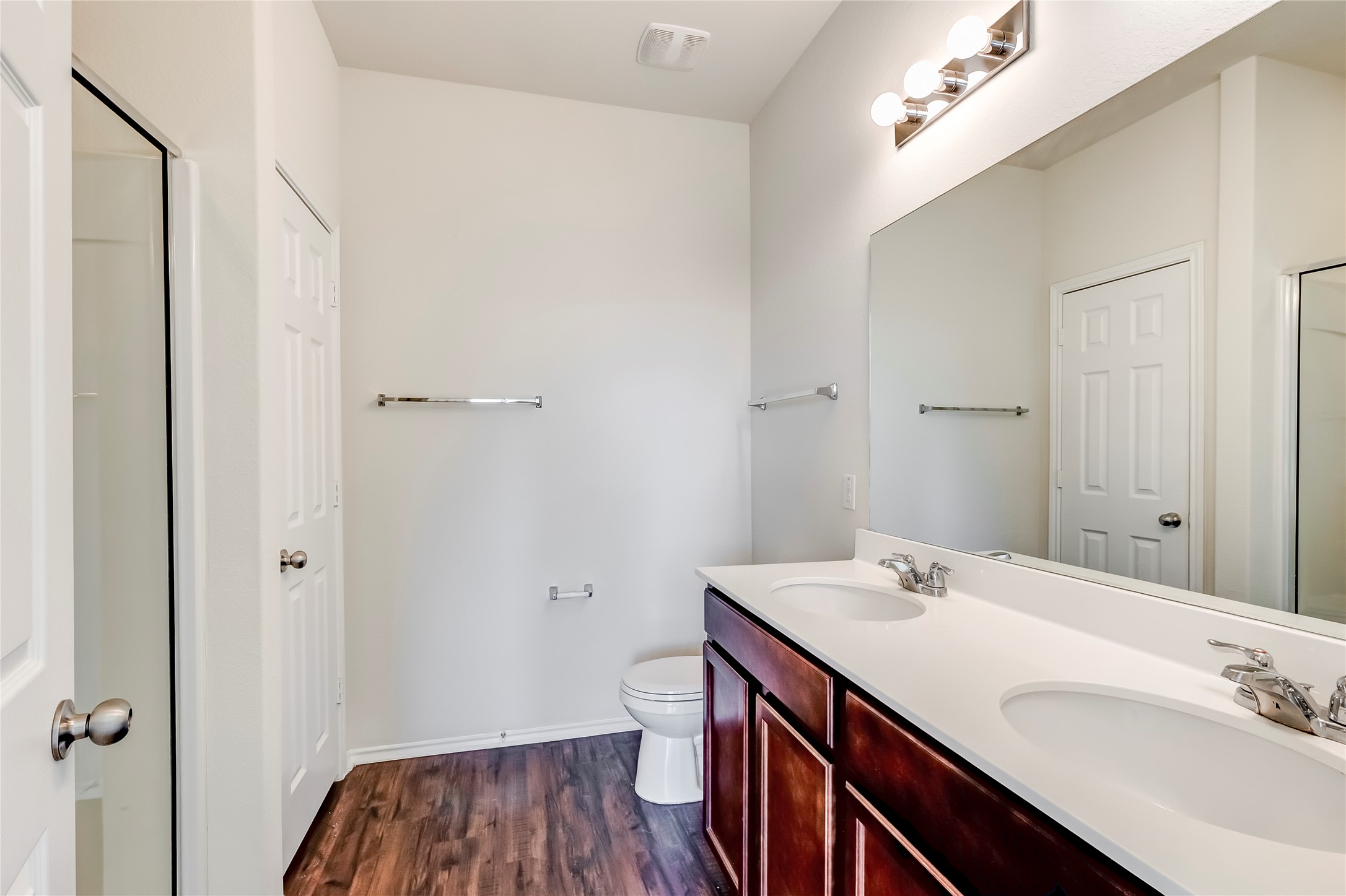 11617 Amber Stream Lane Manor, TX 78653 - Photo 16 of 39 a bathroom with a sink and a mirror