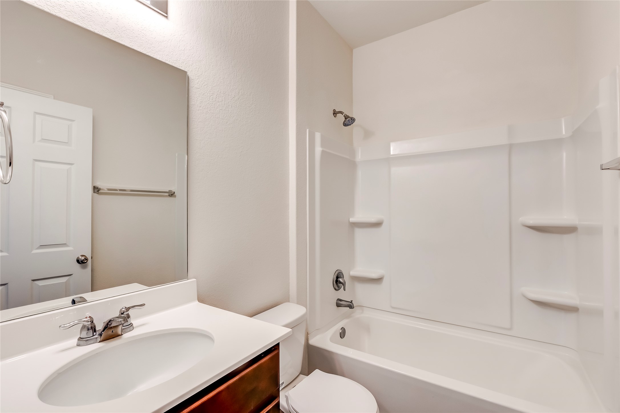 11617 Amber Stream Lane Manor, TX 78653 - Photo 19 of 39 a bathroom with a sink toilet and shower