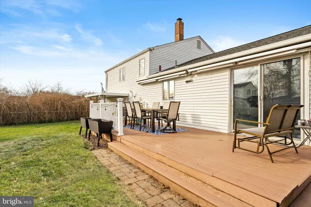 a view of a chairs and table in patio