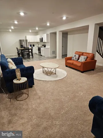 a living room with furniture and a table