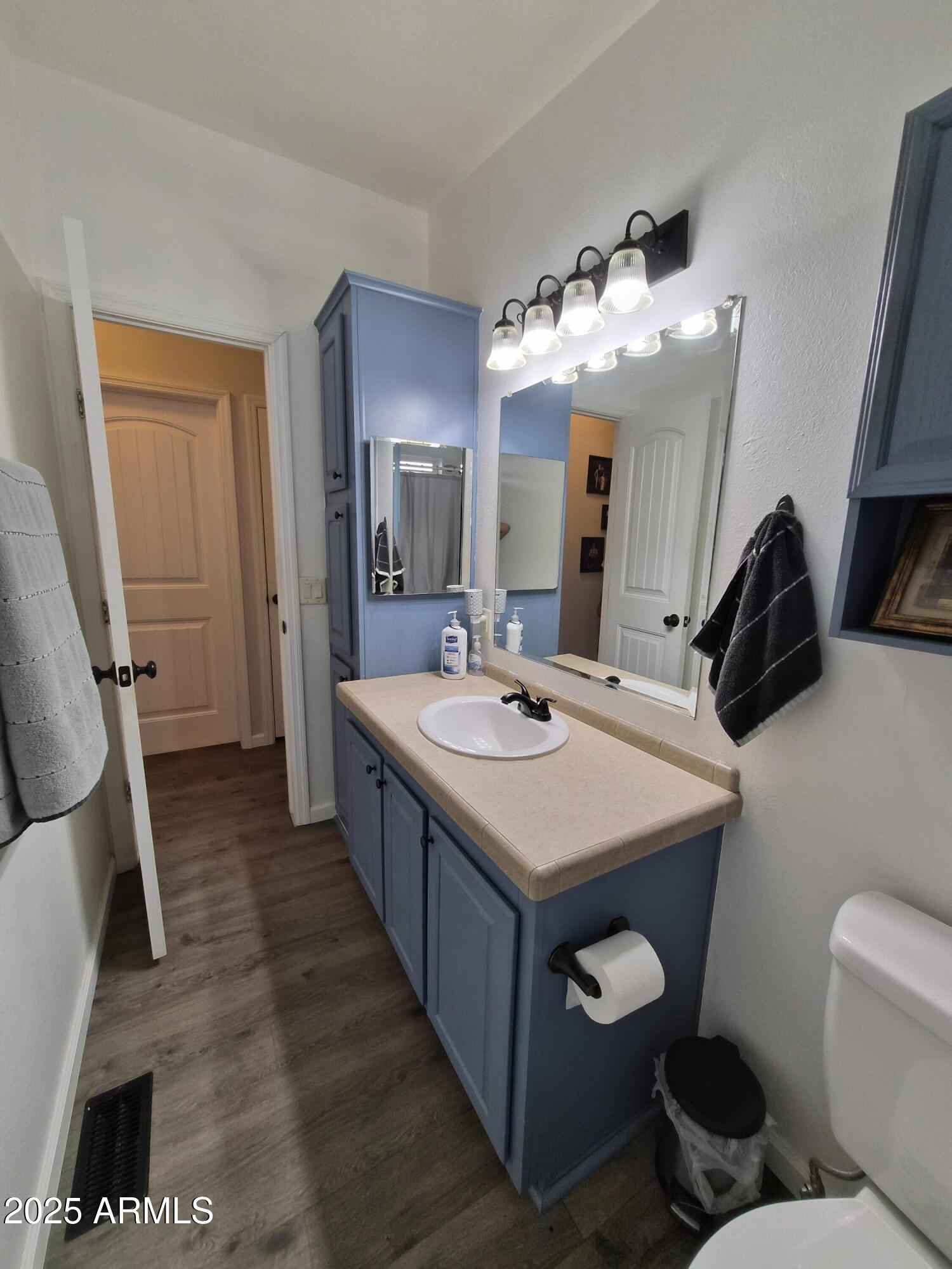 51033 North Mockingbird Road Wickenburg, AZ 85390 - Photo 20 of 51 a bathroom with a sink double vanity and a mirror