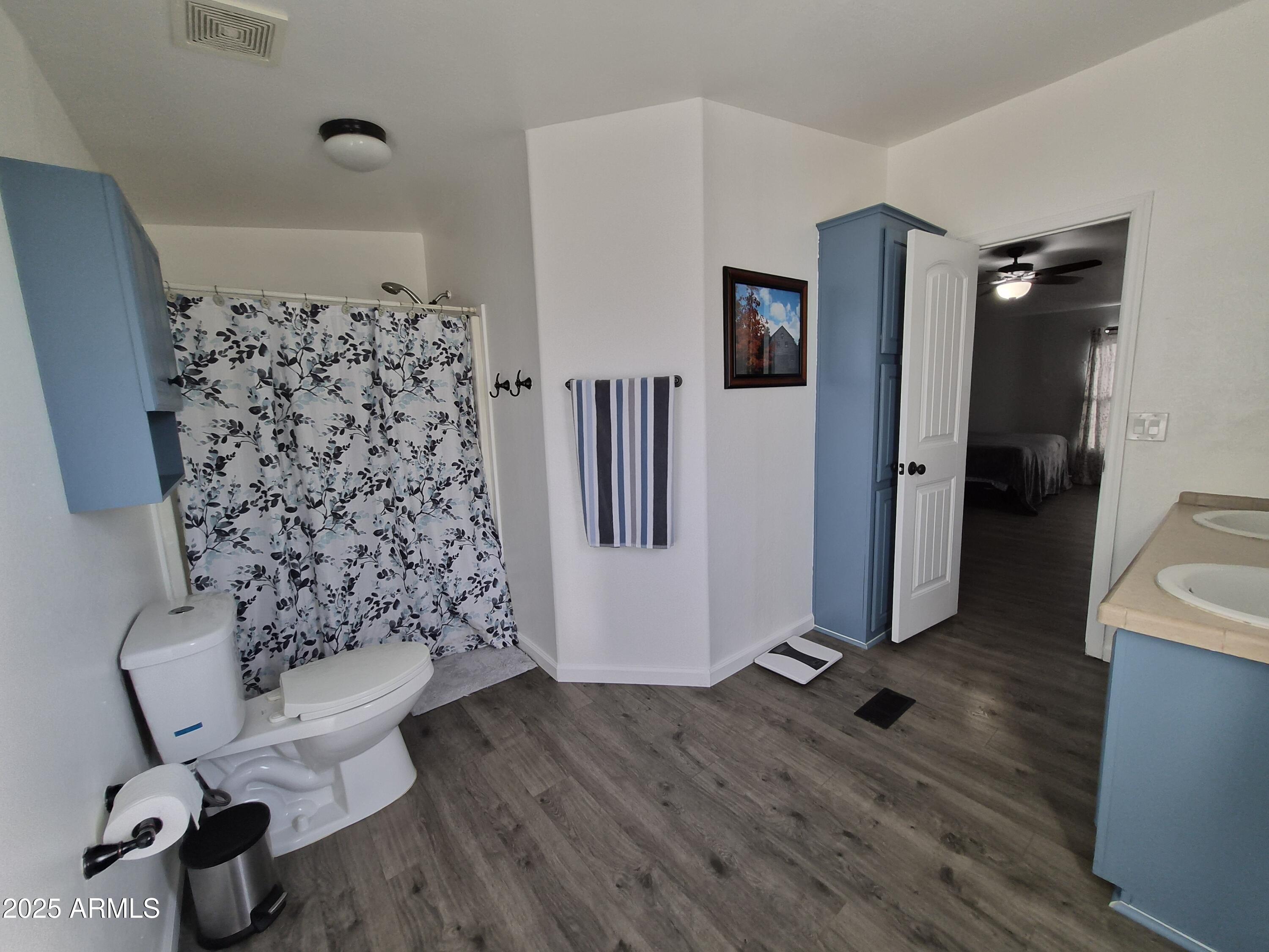 51033 North Mockingbird Road Wickenburg, AZ 85390 - Photo 27 of 51 a bathroom with a toilet and a shower