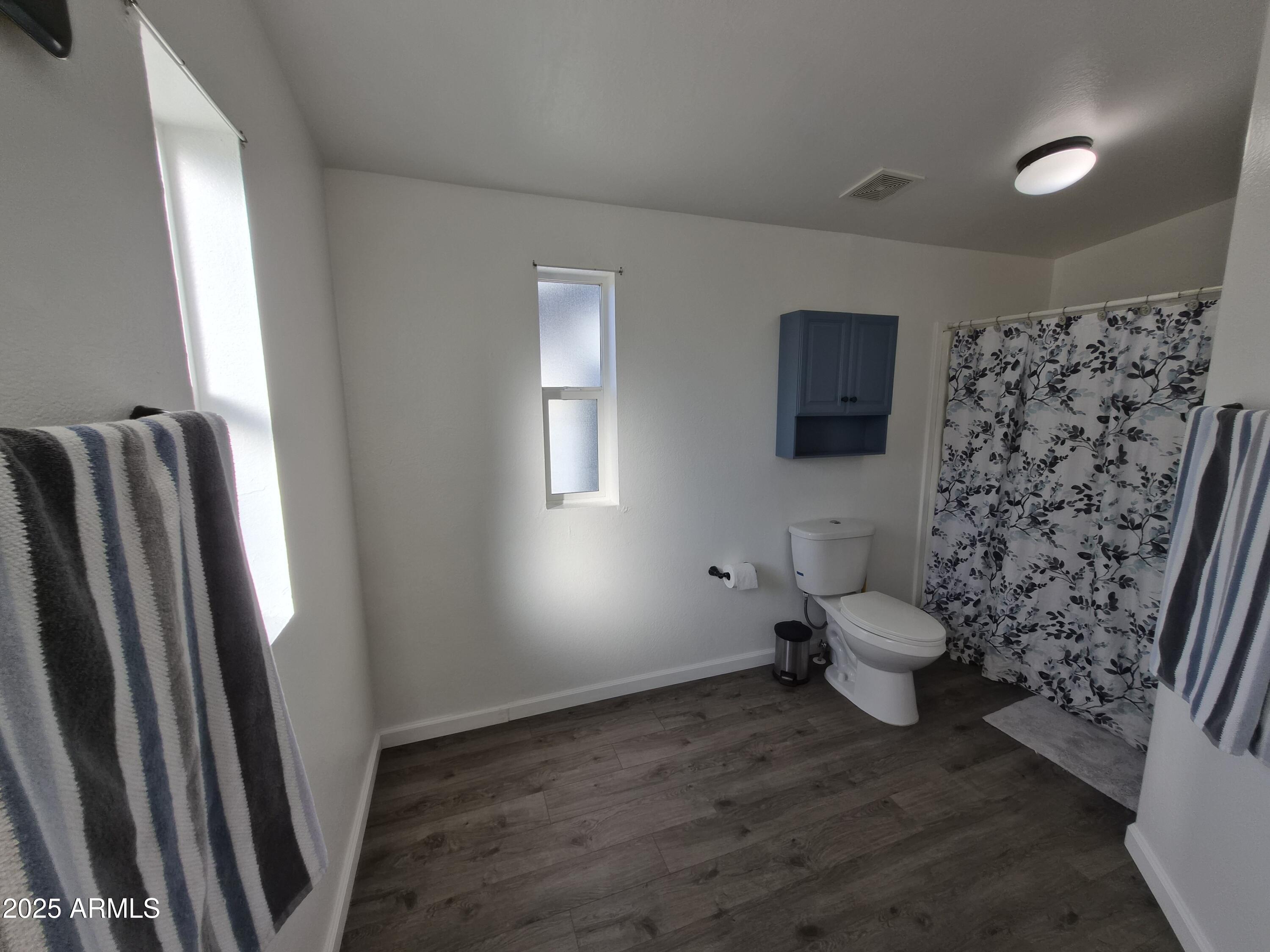 51033 North Mockingbird Road Wickenburg, AZ 85390 - Photo 30 of 51 a bathroom with a toilet and a shower