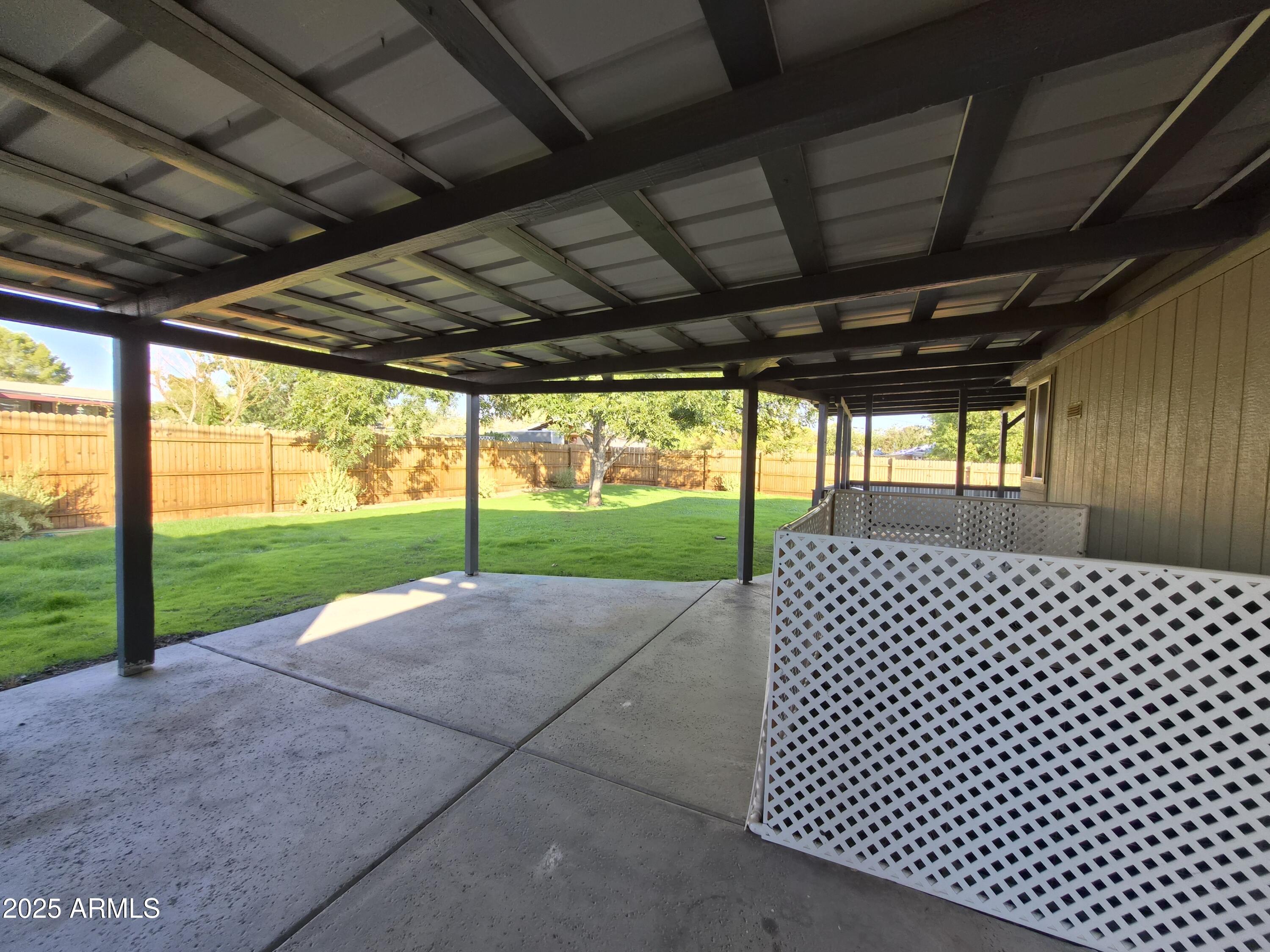 51033 North Mockingbird Road Wickenburg, AZ 85390 - Photo 32 of 51 a view of a backyard with wooden fence