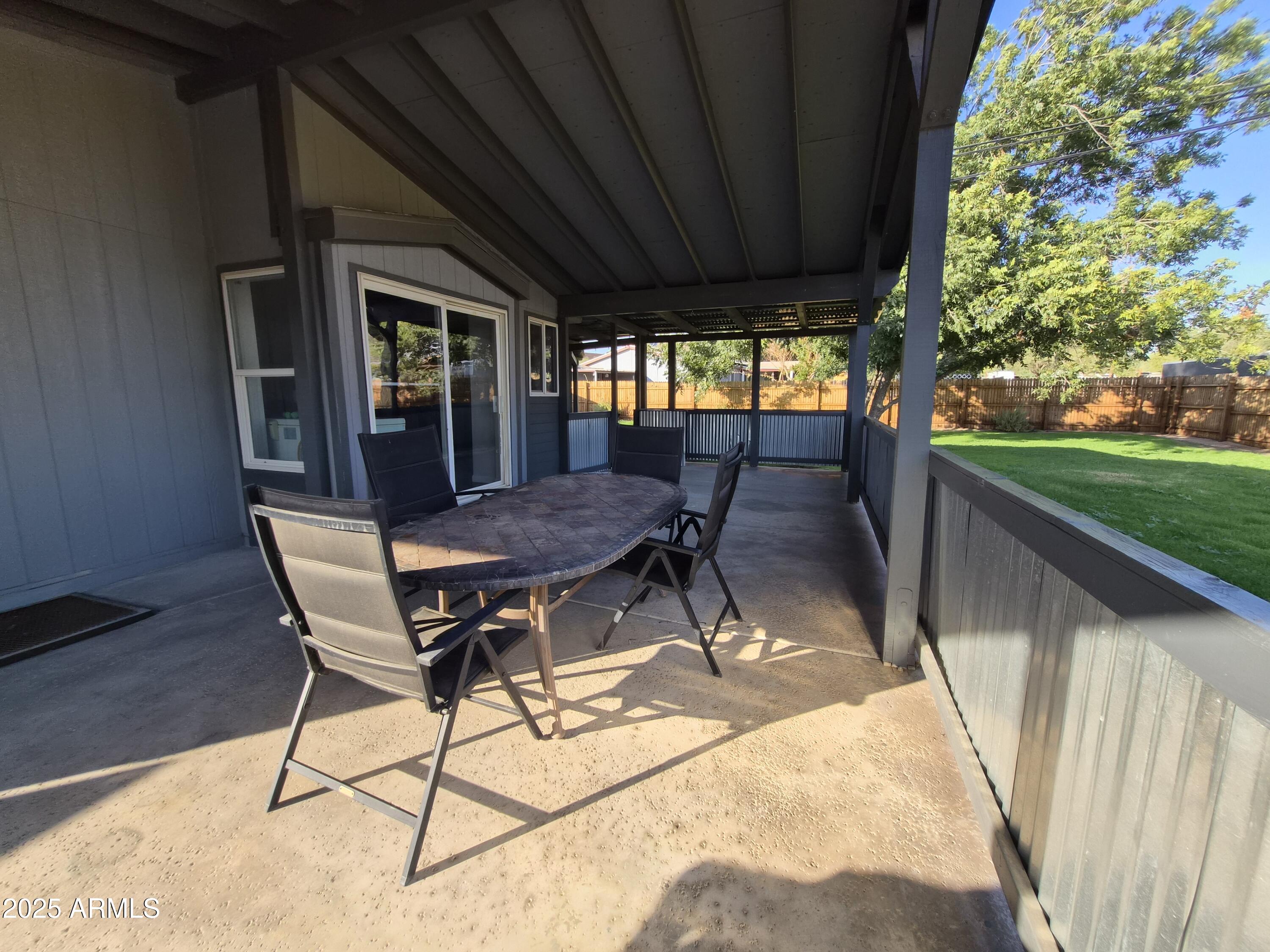 51033 North Mockingbird Road Wickenburg, AZ 85390 - Photo 39 of 51 a view of backyard with a patio and outdoor seating