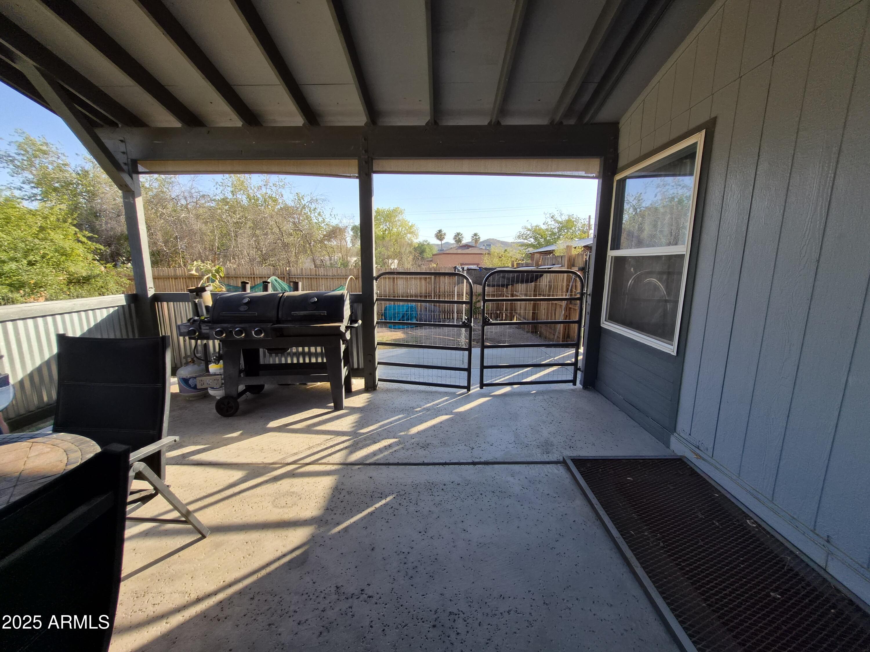 51033 North Mockingbird Road Wickenburg, AZ 85390 - Photo 43 of 51 a view of a porch with furniture and wooden floor