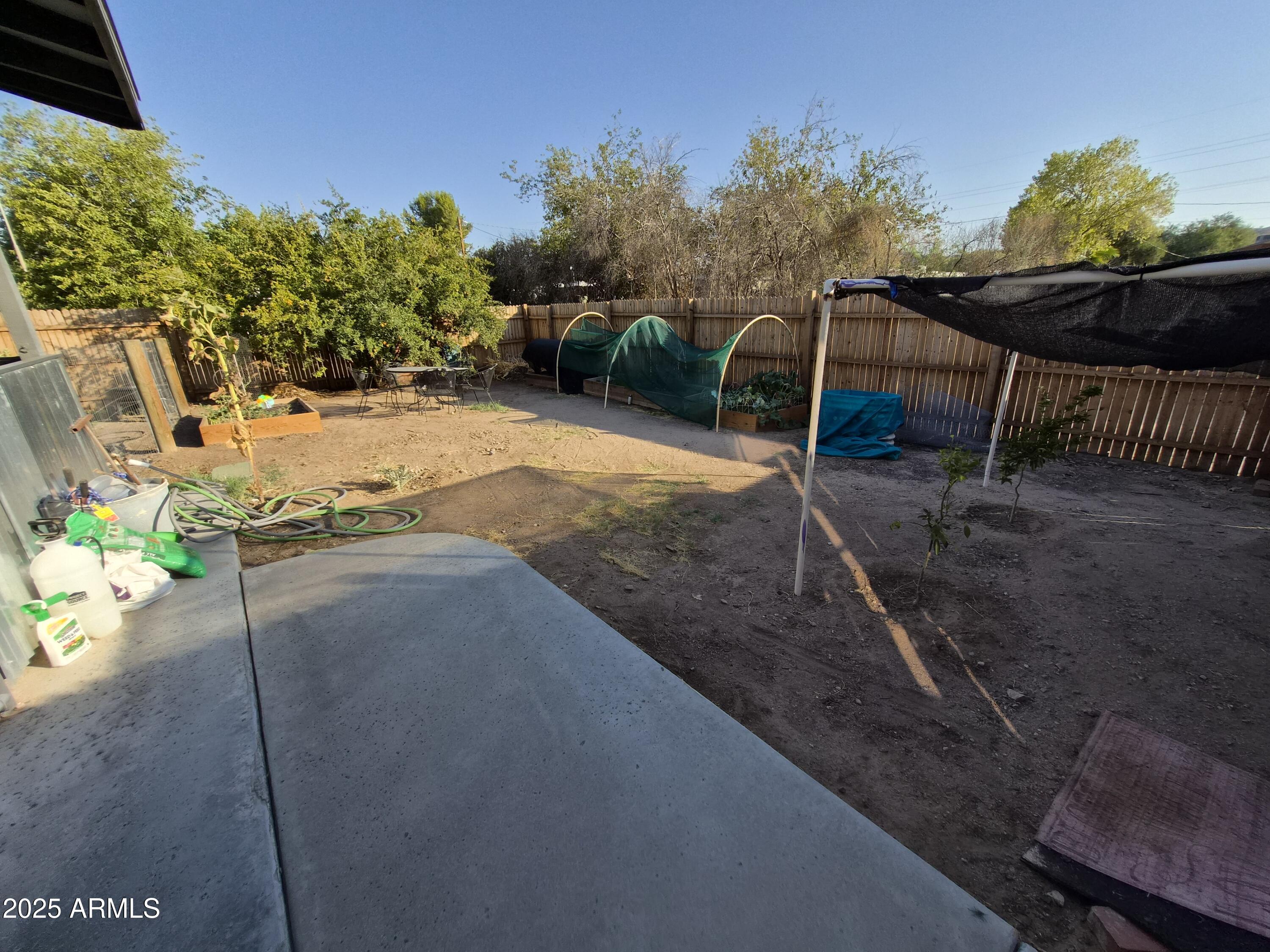 51033 North Mockingbird Road Wickenburg, AZ 85390 - Photo 45 of 51 a view of a backyard with sitting area