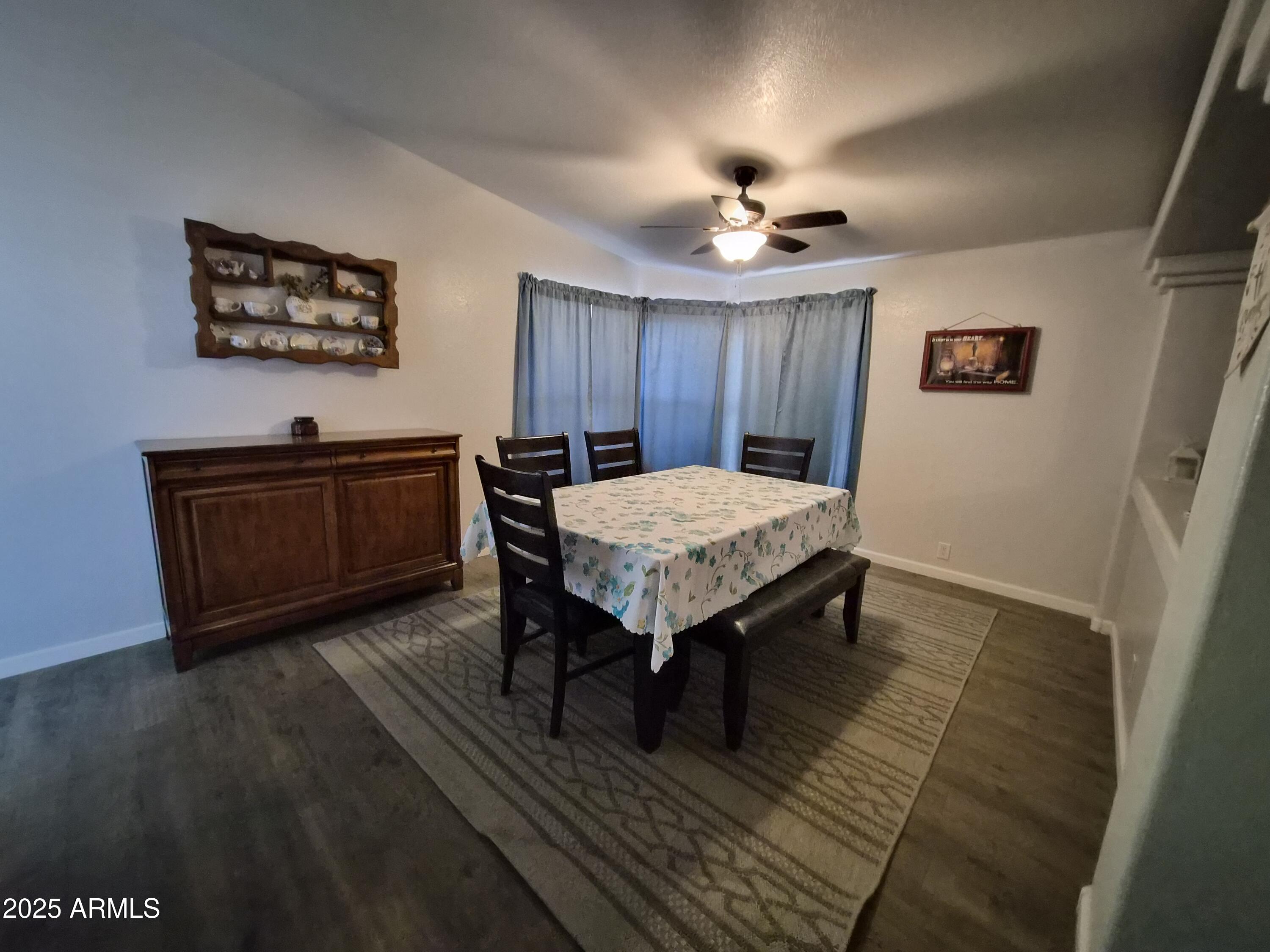 51033 North Mockingbird Road Wickenburg, AZ 85390 - Photo 5 of 51 a view of a livingroom with furniture and wooden floor