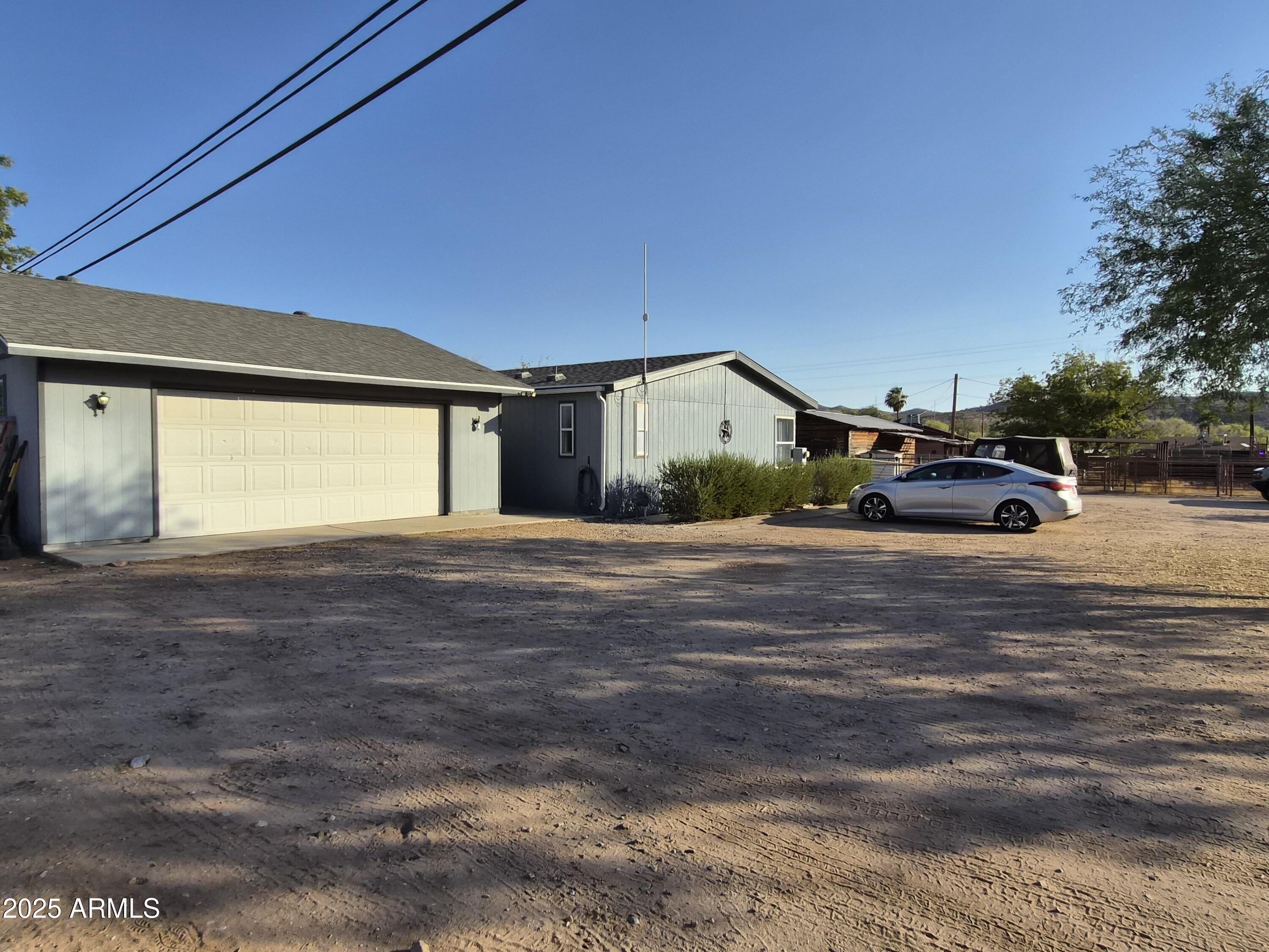 51033 North Mockingbird Road Wickenburg, AZ 85390 - Photo 51 of 51 a car parked in front of a house