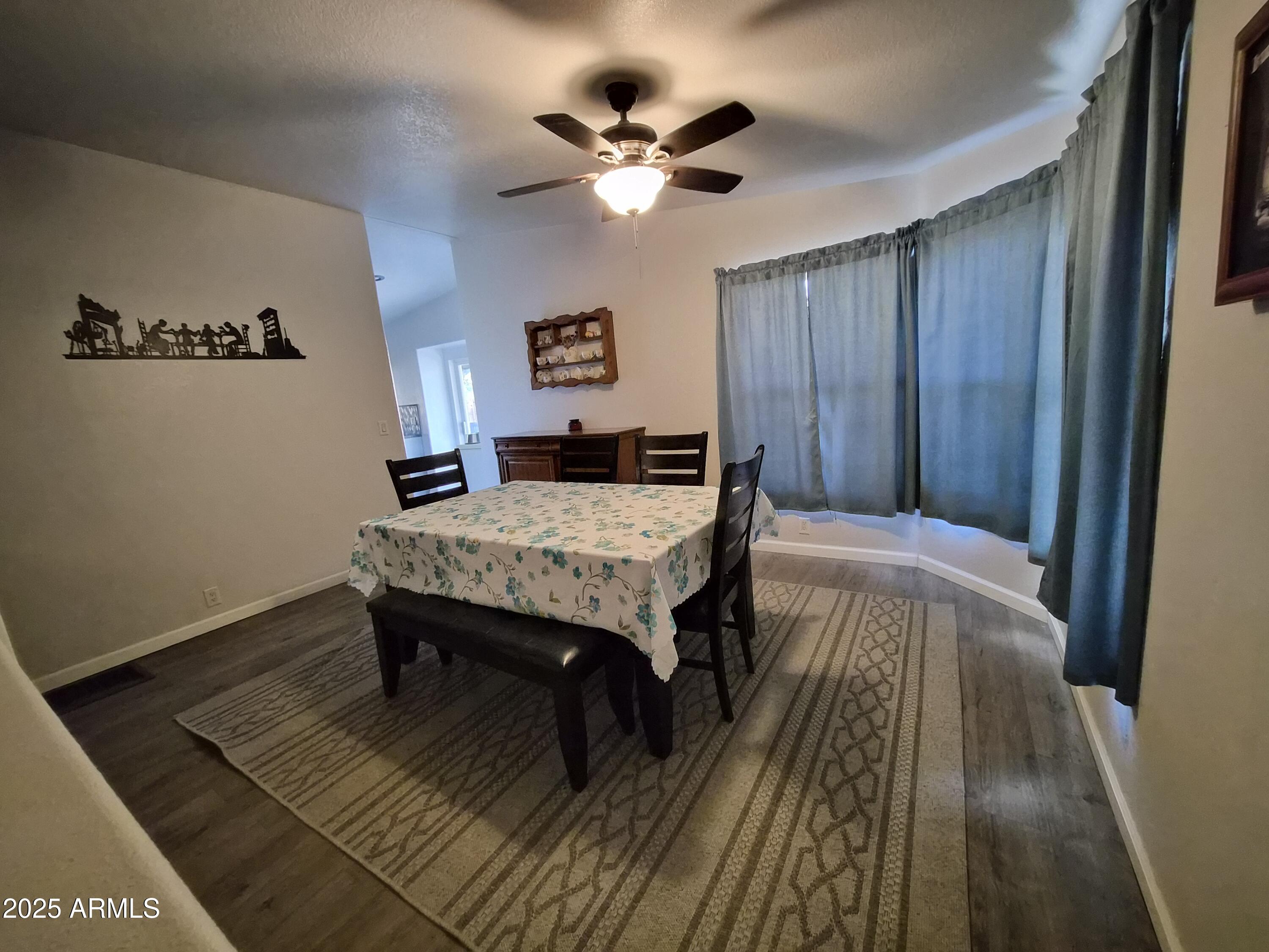 51033 North Mockingbird Road Wickenburg, AZ 85390 - Photo 7 of 51 a living room with a bed furniture and a window