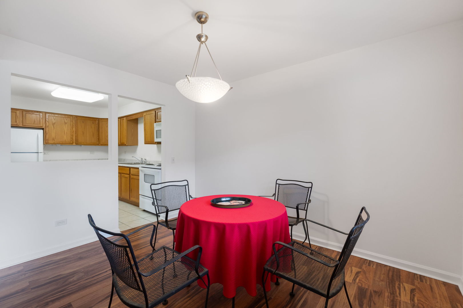 435 Ridge Road, Unit 108 Wilmette, IL 60091 - Photo 8 of 18 a view of a dining room with furniture and wooden floor