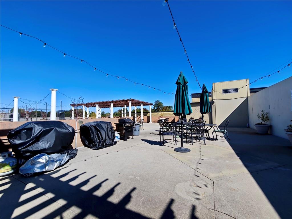 5300 Peachtree Road, Unit 2401 Chamblee, GA 30341 - Photo 19 of 24 a view of a dining room with furniture and chandelier