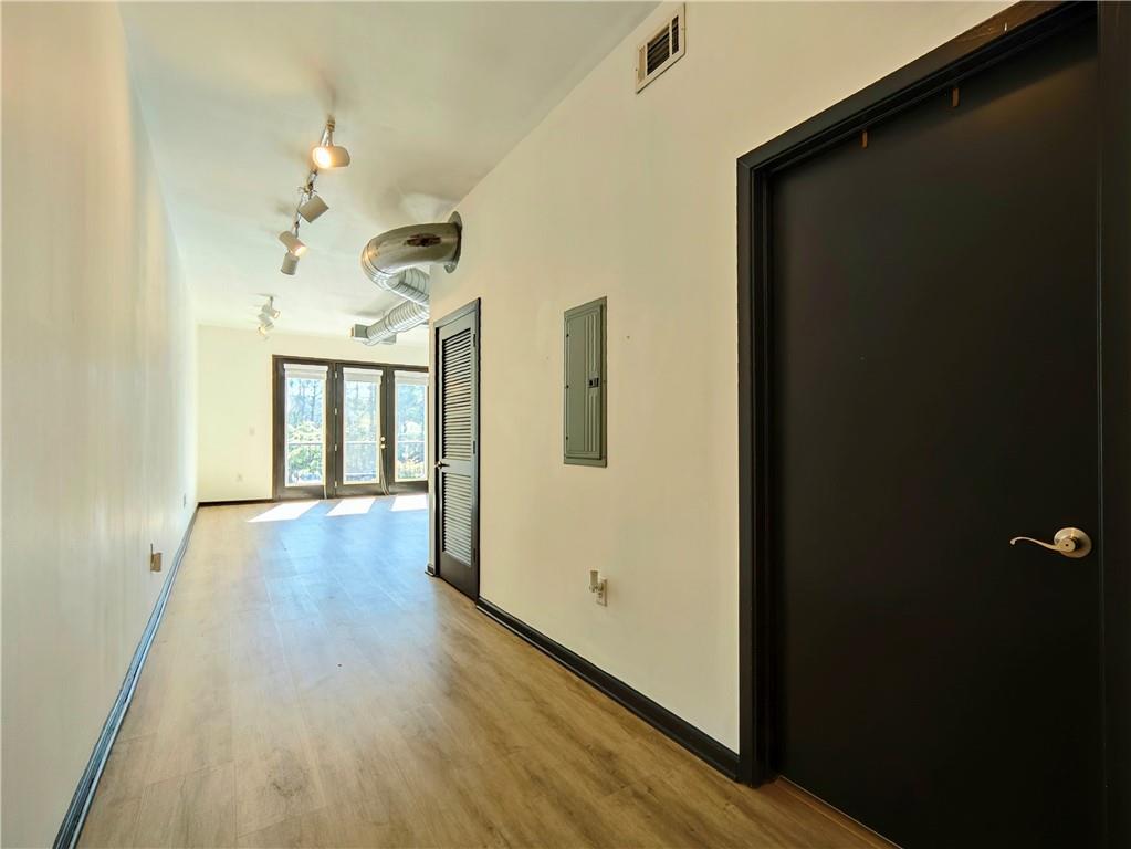 5300 Peachtree Road, Unit 2401 Chamblee, GA 30341 - Photo 2 of 24 a view of a hallway with wooden floor and stairs
